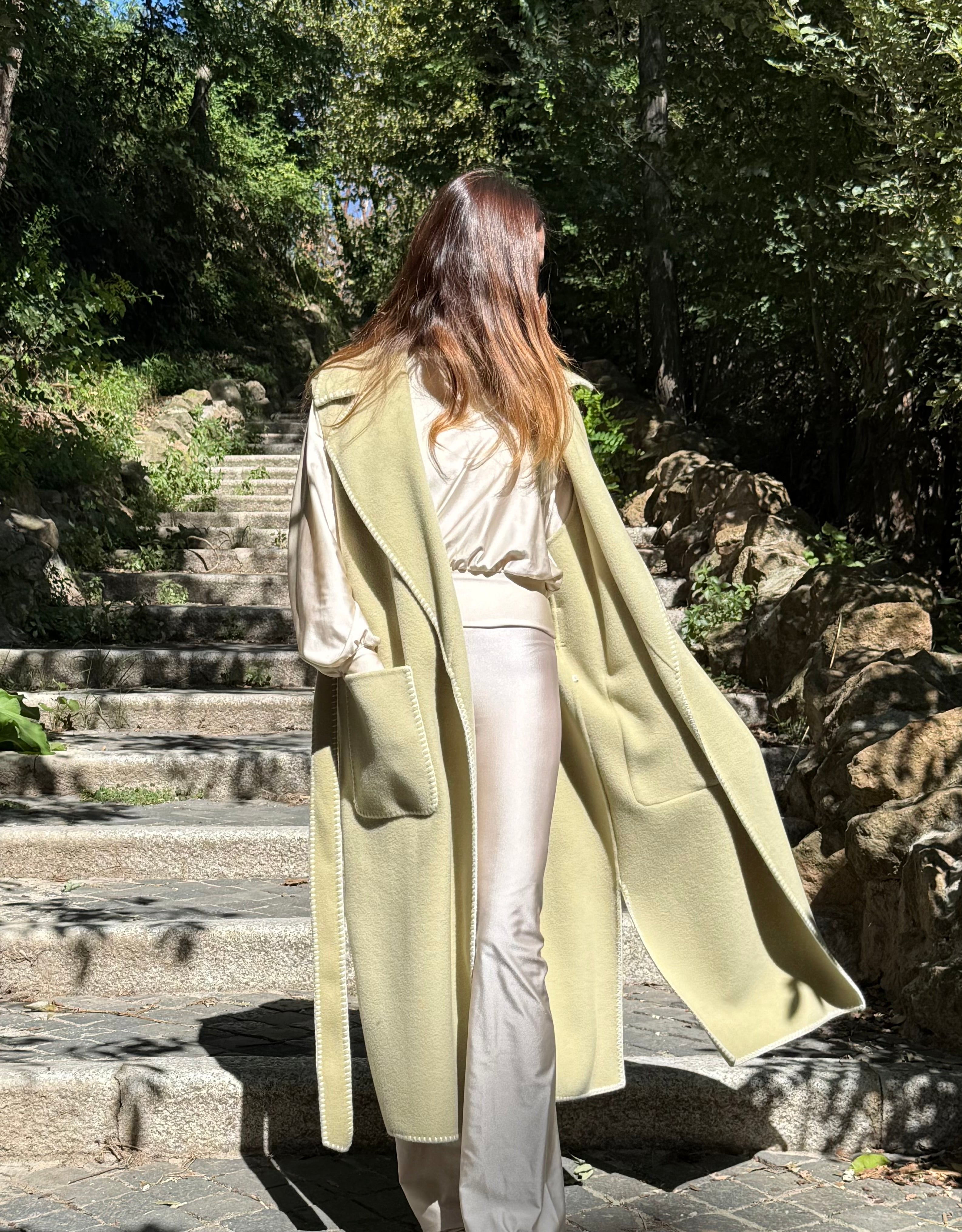 Tailored sleeveless light green wool coat limited edition