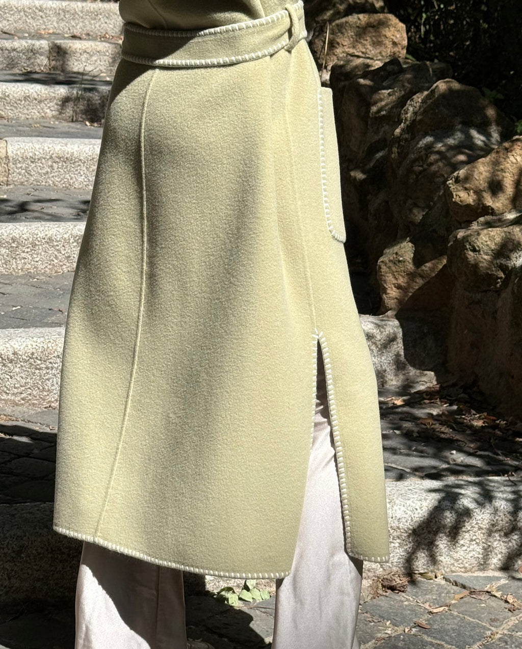 Tailored sleeveless light green wool coat limited edition