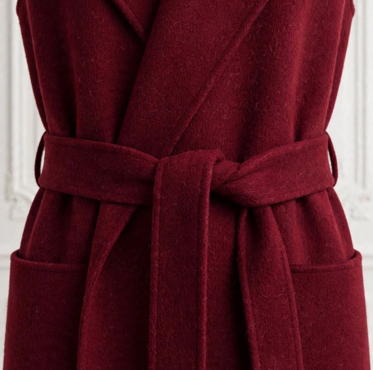 Burgundy sleeveless wrap coat with belt