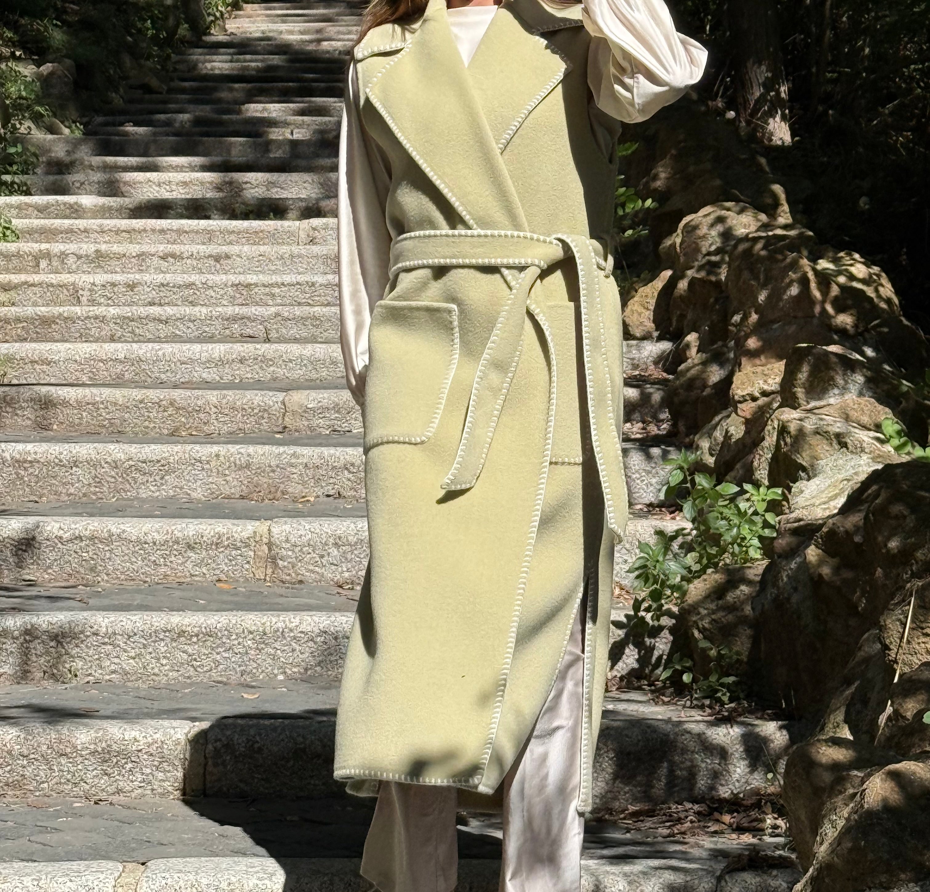 Tailored sleeveless light green wool coat limited edition
